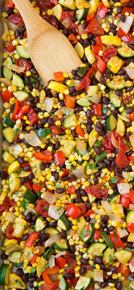 close up of veggie taco filling with wooden spatula