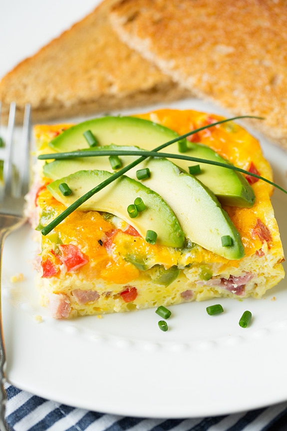 Baked Denver Omelet piece on plate with toast