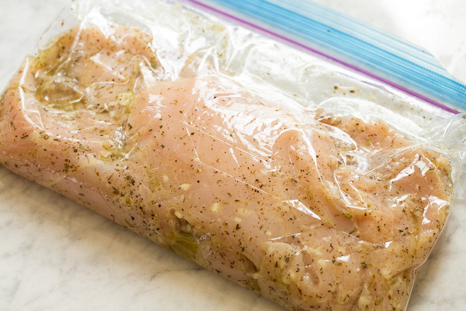 Caprese Chopped Salad Chicken breasts in an Italian marinade in a resealable bag.