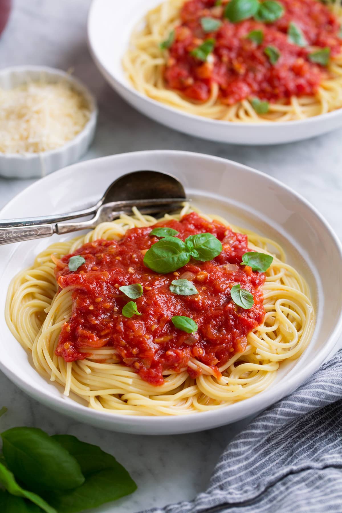 Mound of marinara sauce over spaghetti