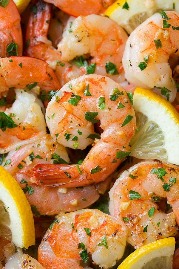 Garlic Lemon Butter Shrimp Close up image of cooked shrimp with garlic, lemon and butter.