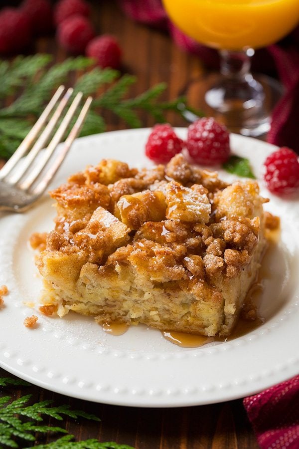 Overnight French Toast Casserole on plate with raspberries