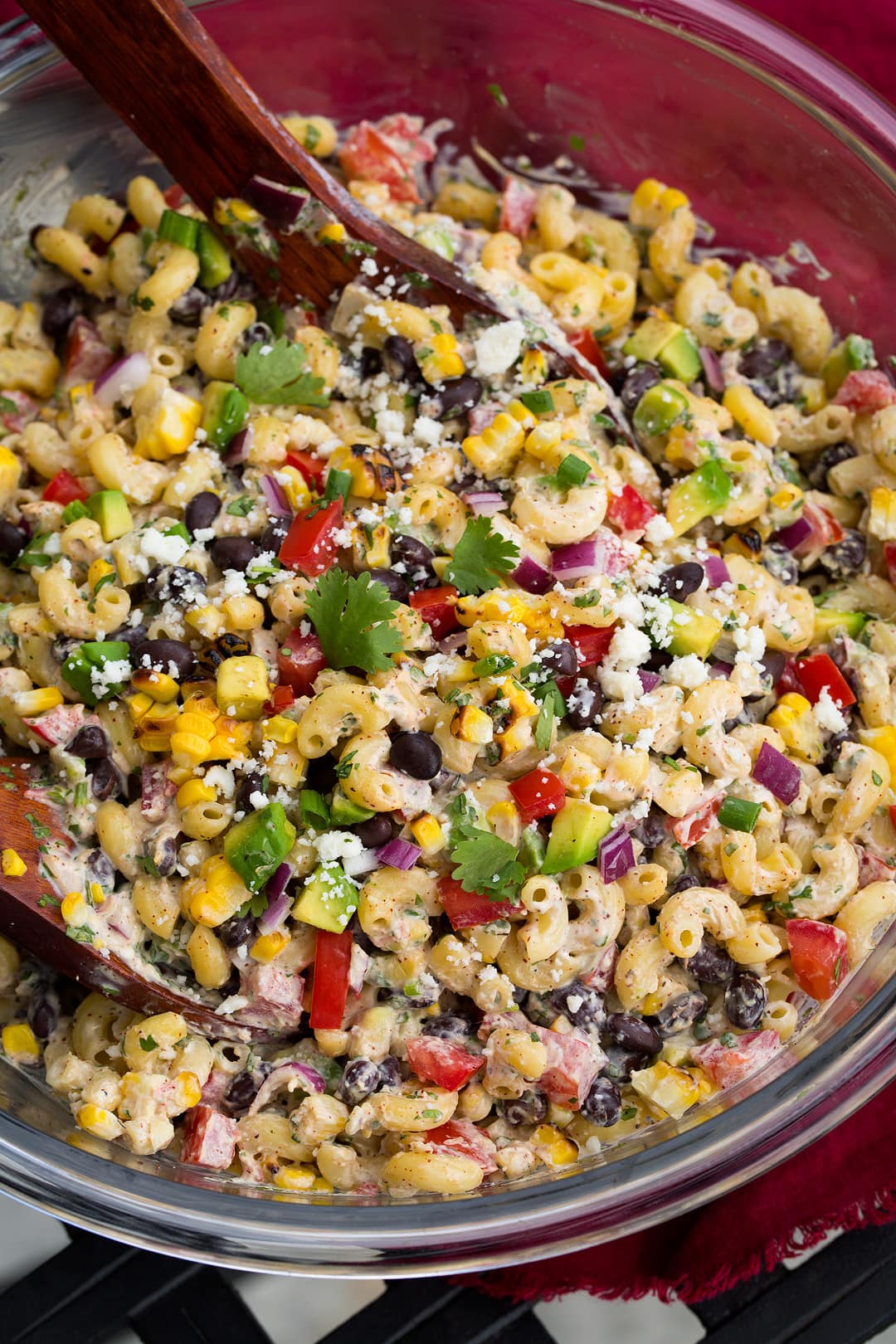Mexican pasta Salad in a glass mixing bowl.