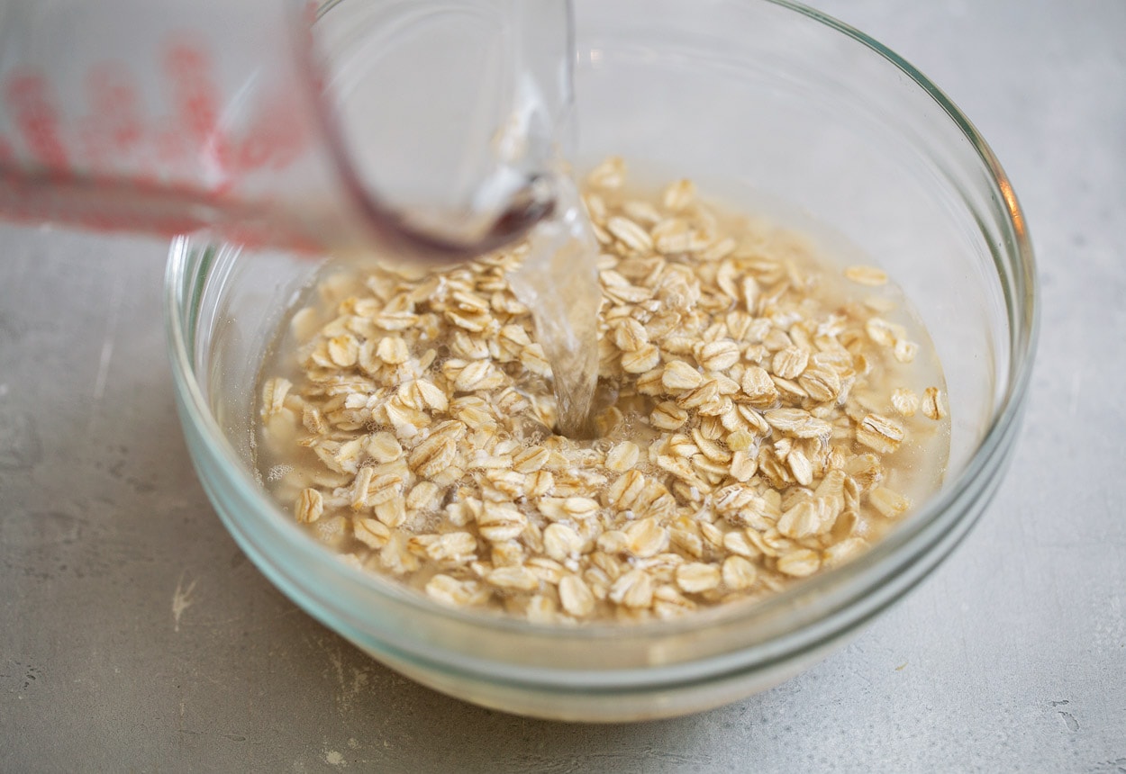mixing boiling water with oats