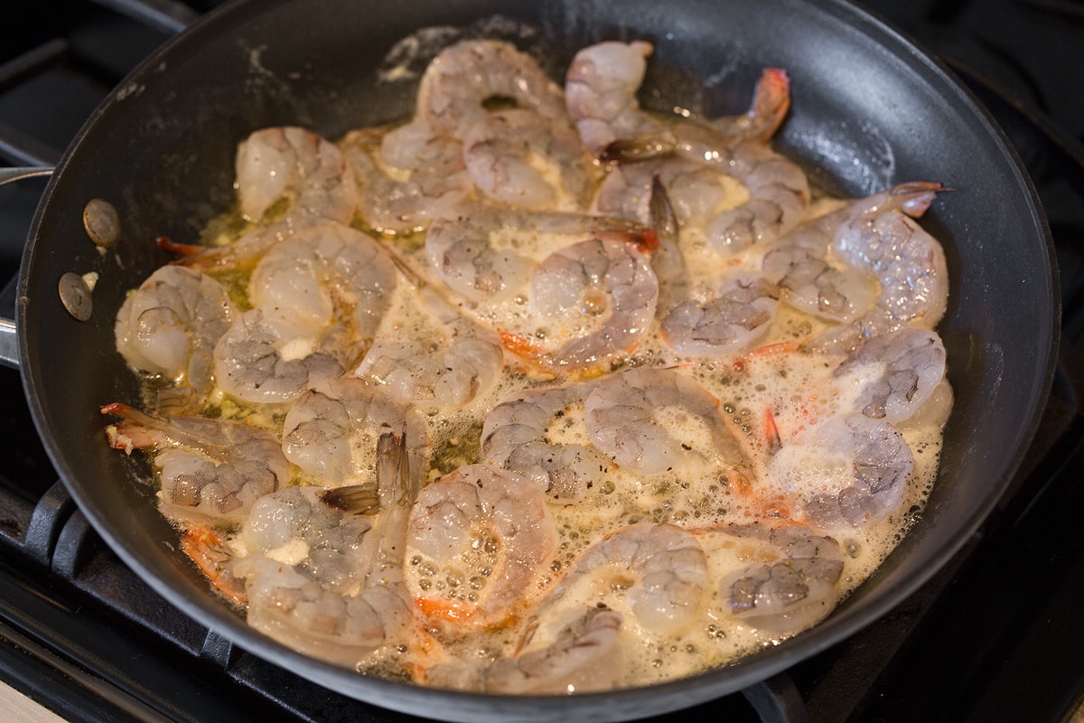 Shrimp with Honey Lime Sauce (Only 5 Ingredients!) Cooking shrimp, honey and lime in skillet over stove top.