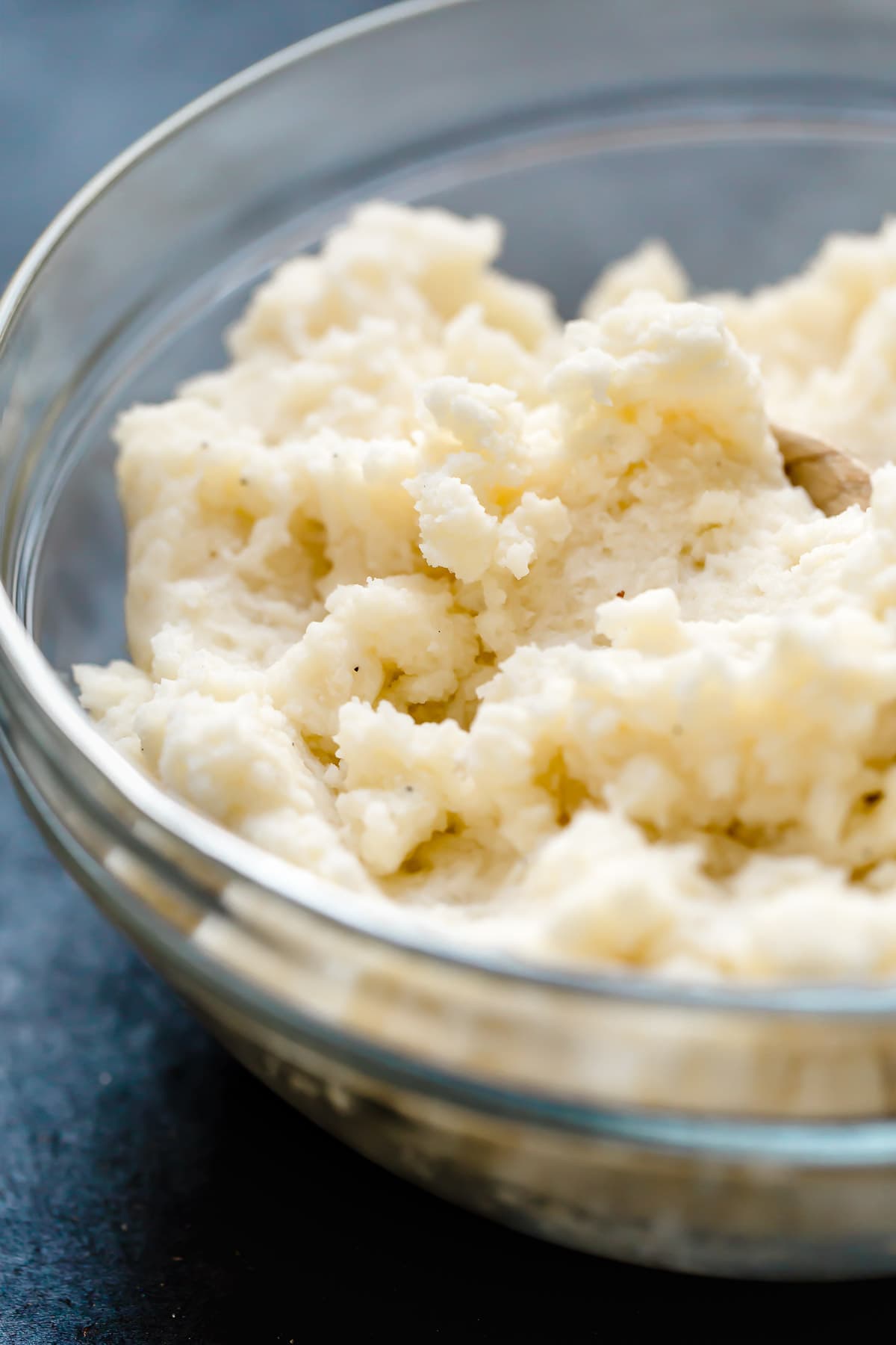Twice Baked Potatoes Fluffy mashed potatoes in a glass mixing bowl.