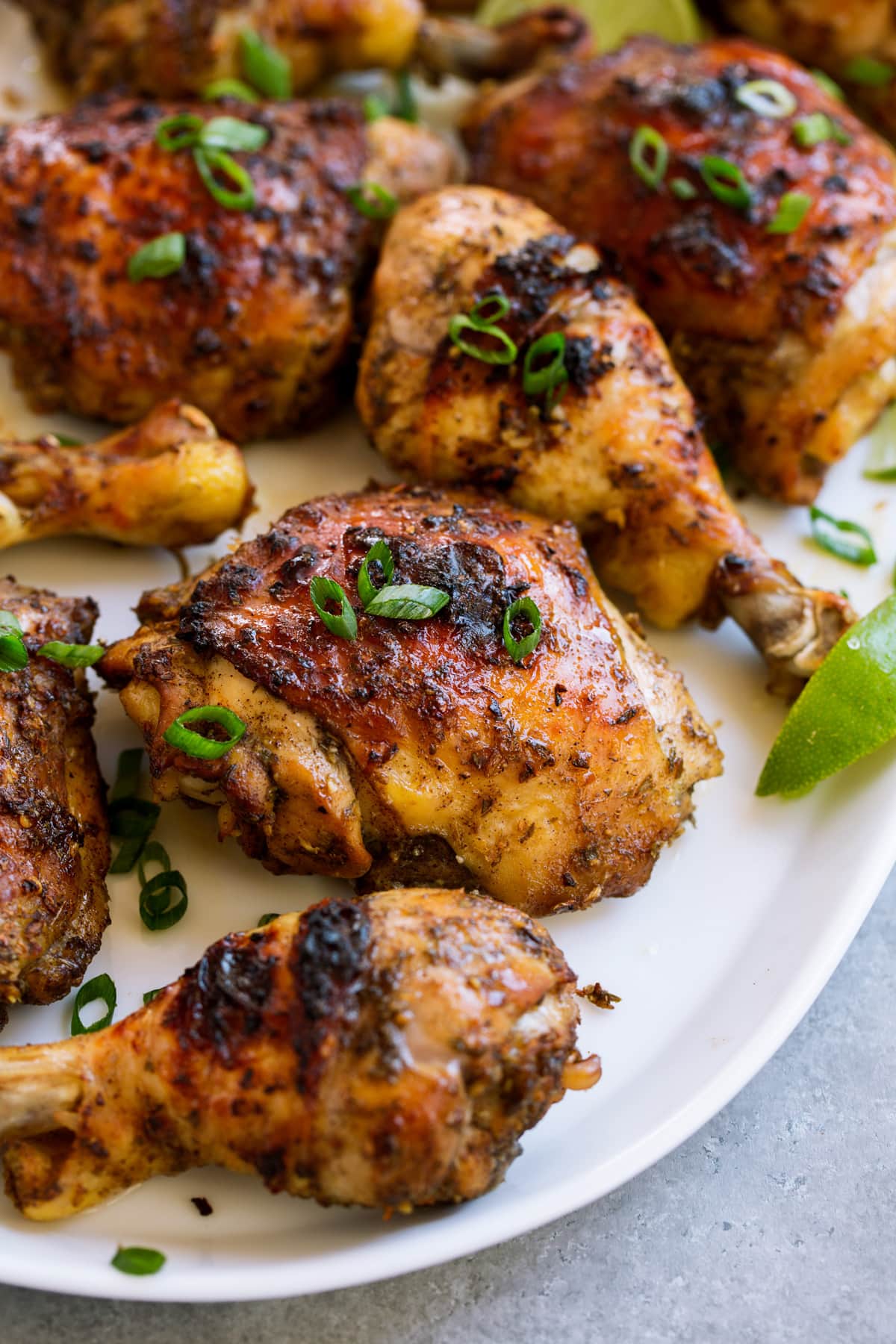Jerk chicken pieces on a serving platter.