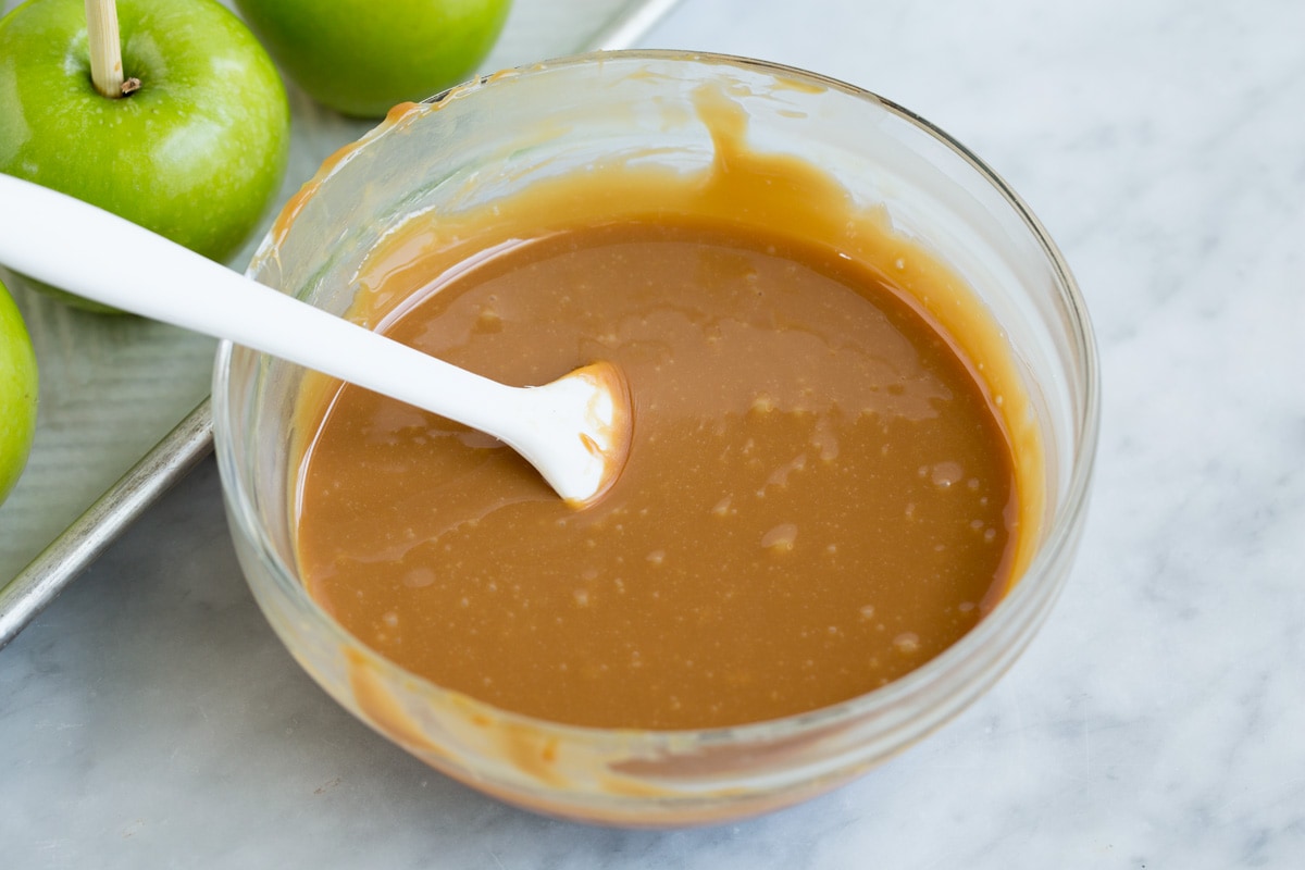 melted caramel in a glass mixing bowl.