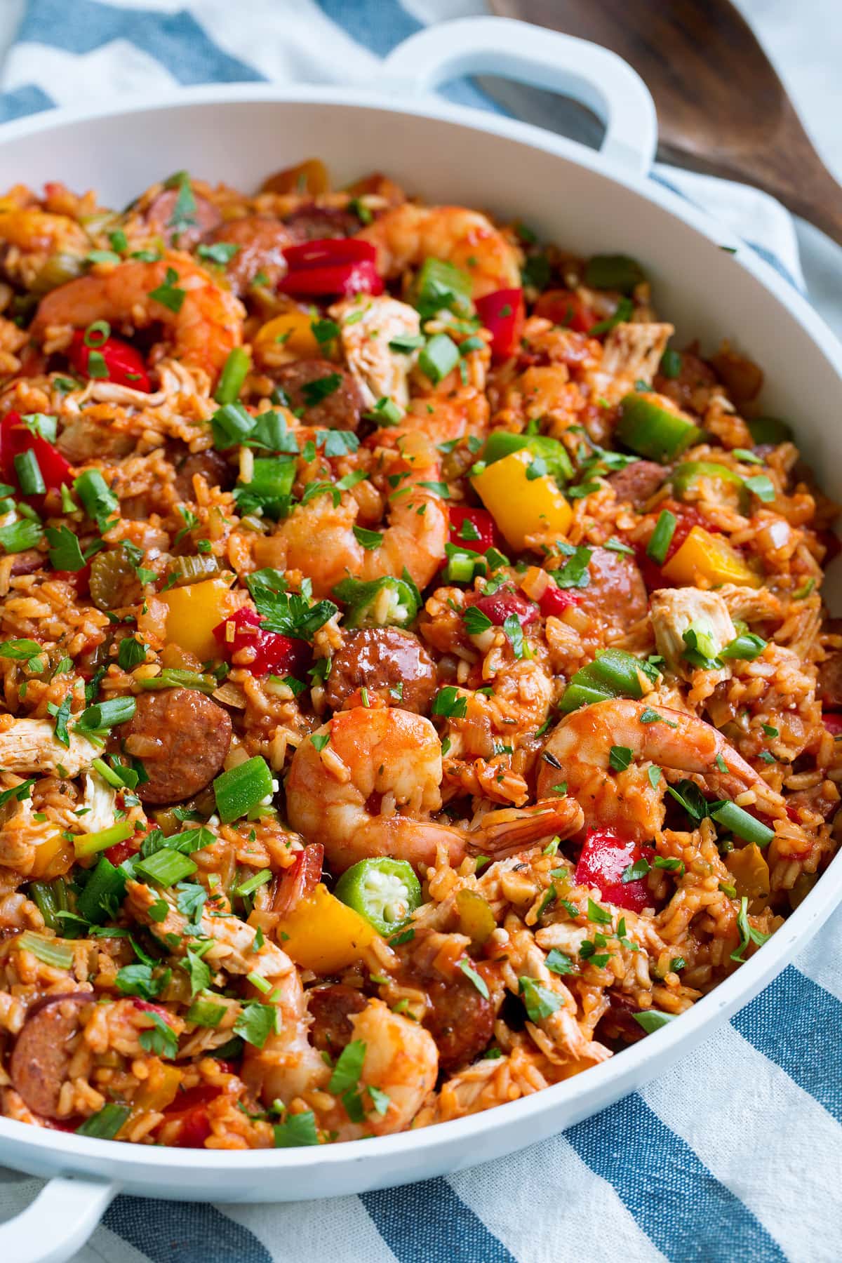 Pan full of homemade jamabalaya with shrimp, sausage, chicken, rice and vegetables.