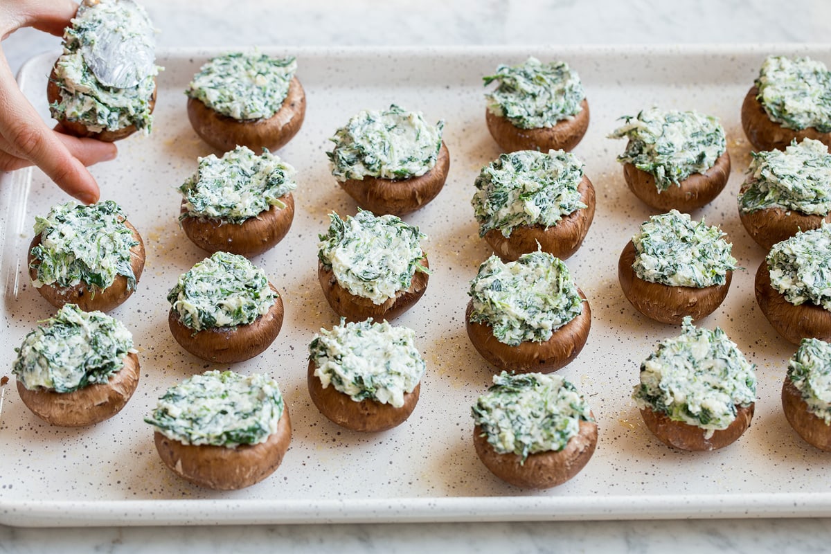 Stuffed Mushrooms Filling mushroom caps with cheese filling.