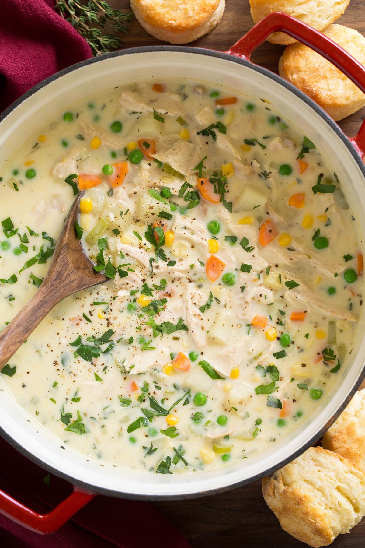 Pot full of chicken pot pie soup with ladle in the soup.