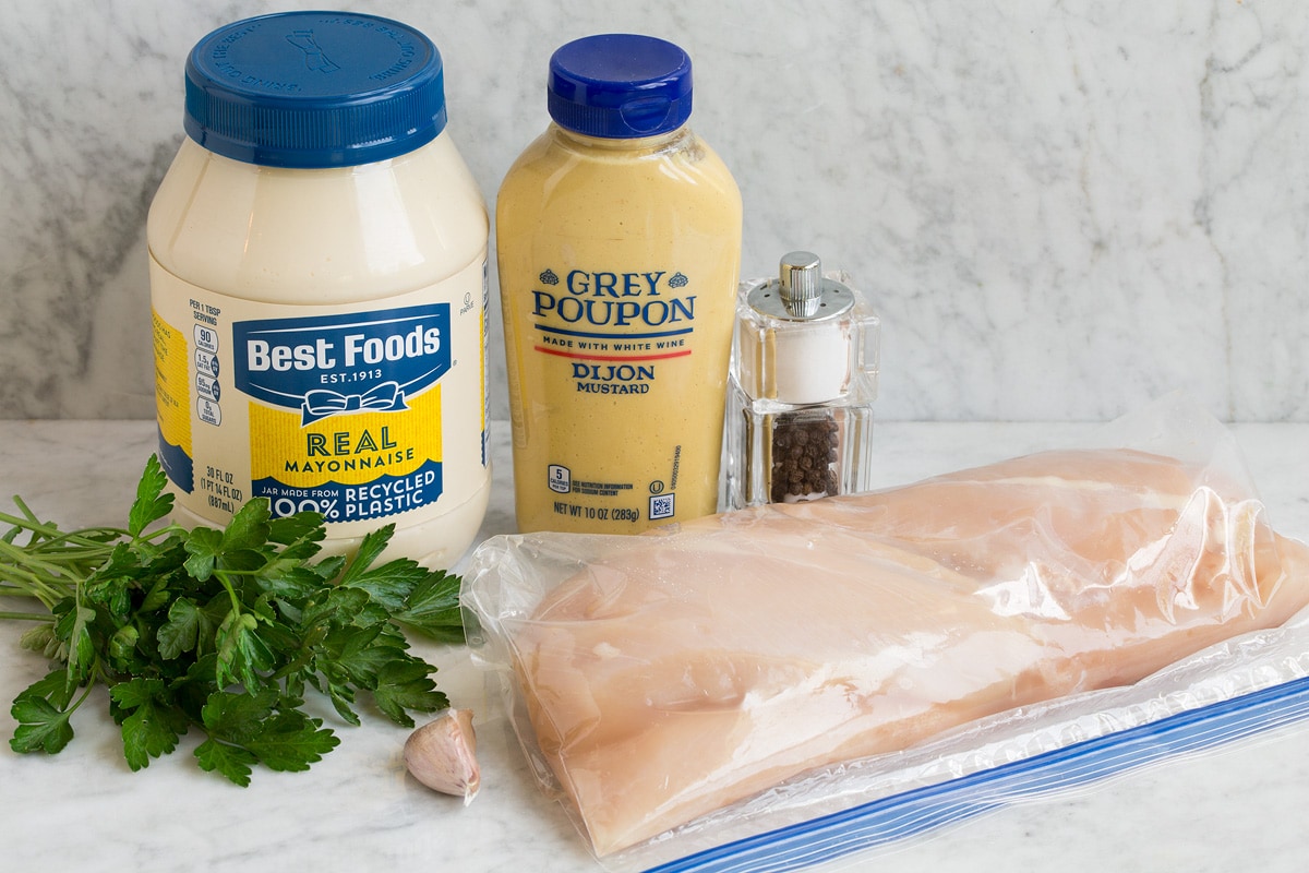 Grilled Dijon Chicken Image of ingredients shown to make dijon chicken. Includes chicken breasts, dijon mustard, mayonnaise, salt and pepper, garlic and optional parsley.