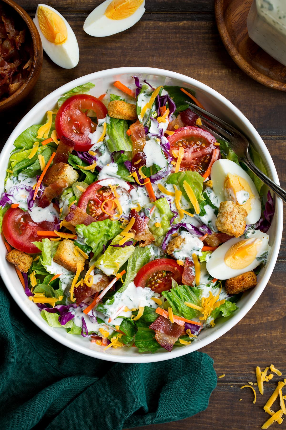 Ranch Dressing Homemade ranch dressing shown over a green salad.