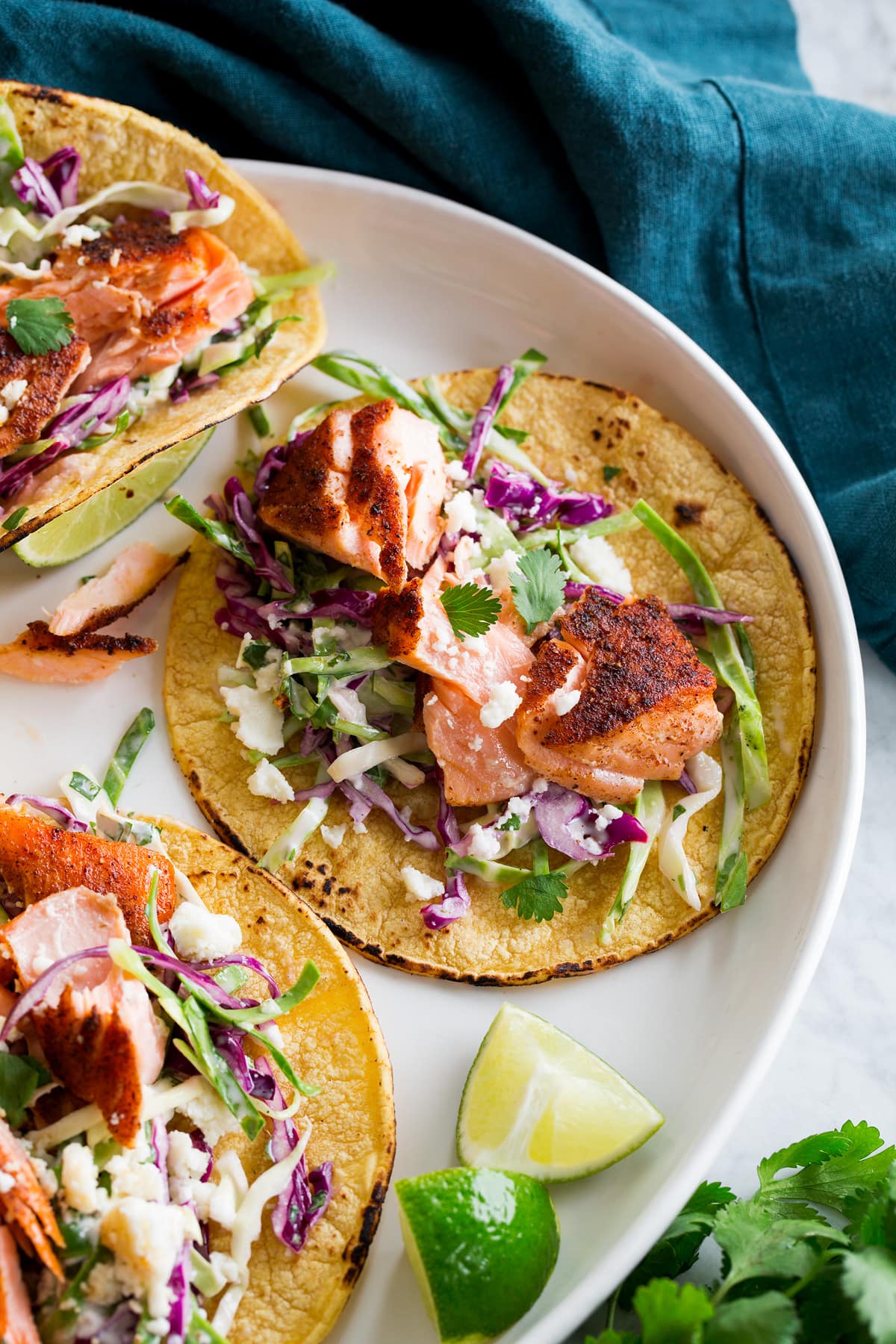 Salmon Tacos Close up photo of flaked seared salmon taco.