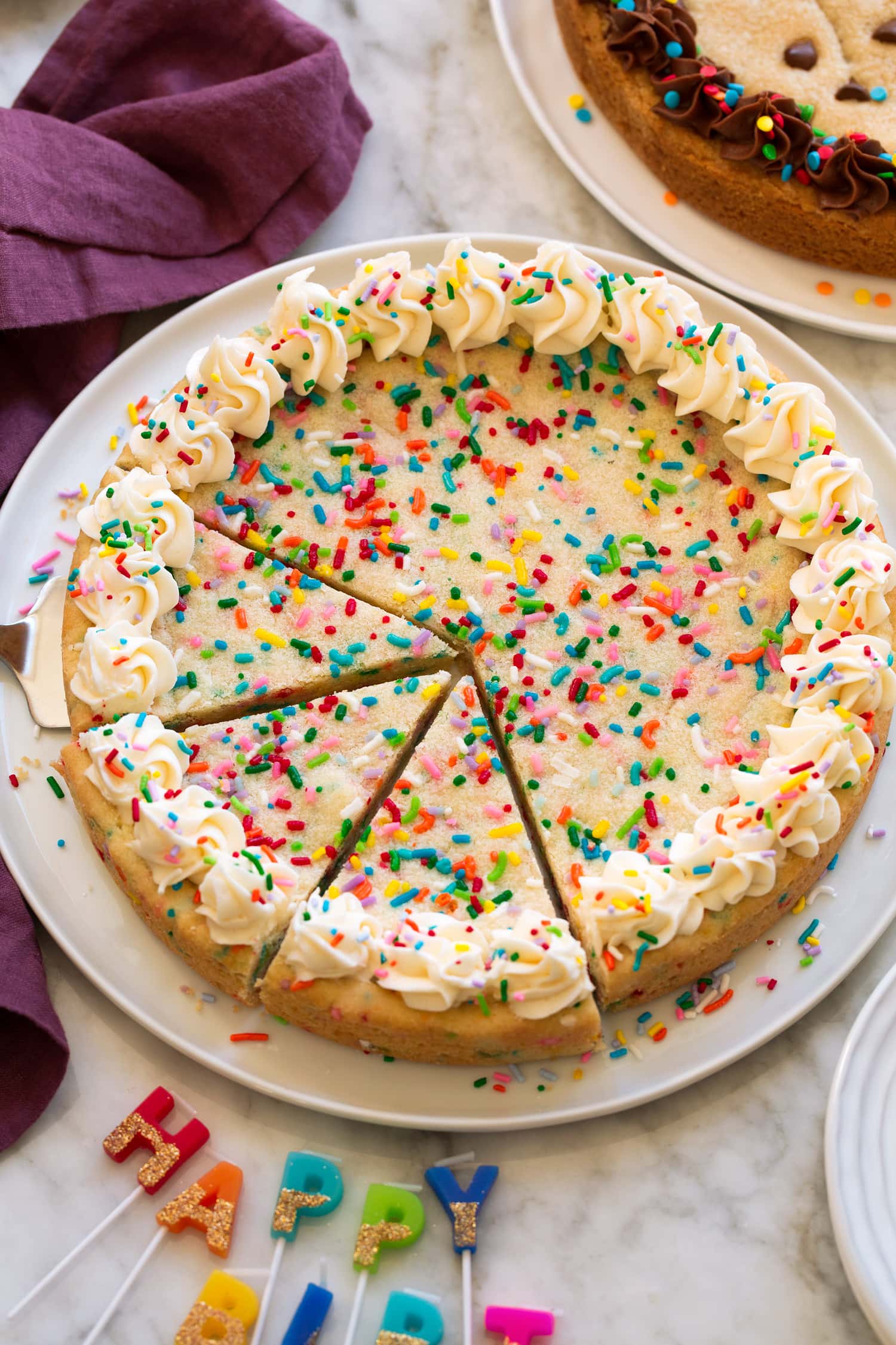 Cookie Cake Whole sugar cookie cake with frosting on edges.