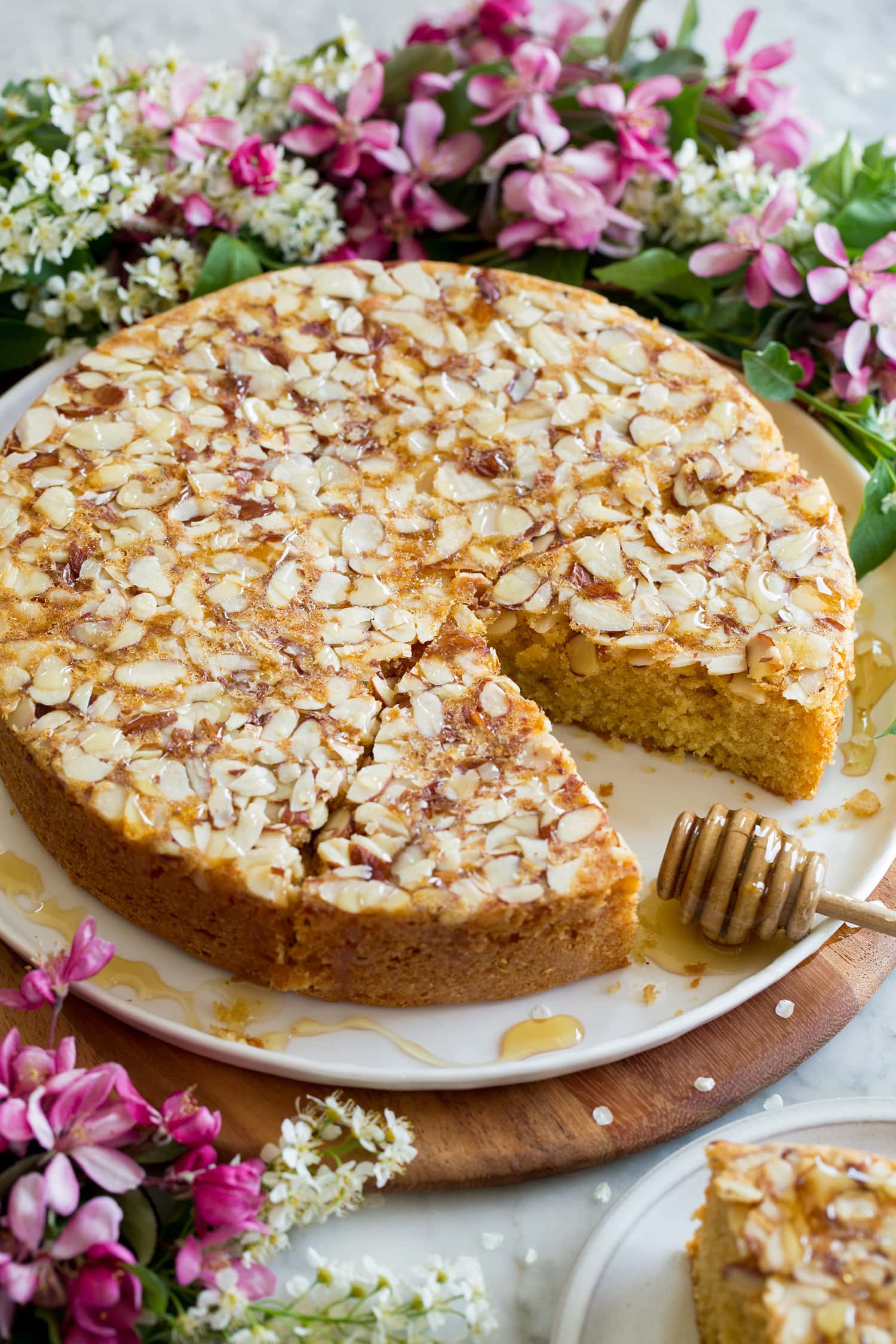 Honey Cake Whole honey cake on a platter cut into slices.