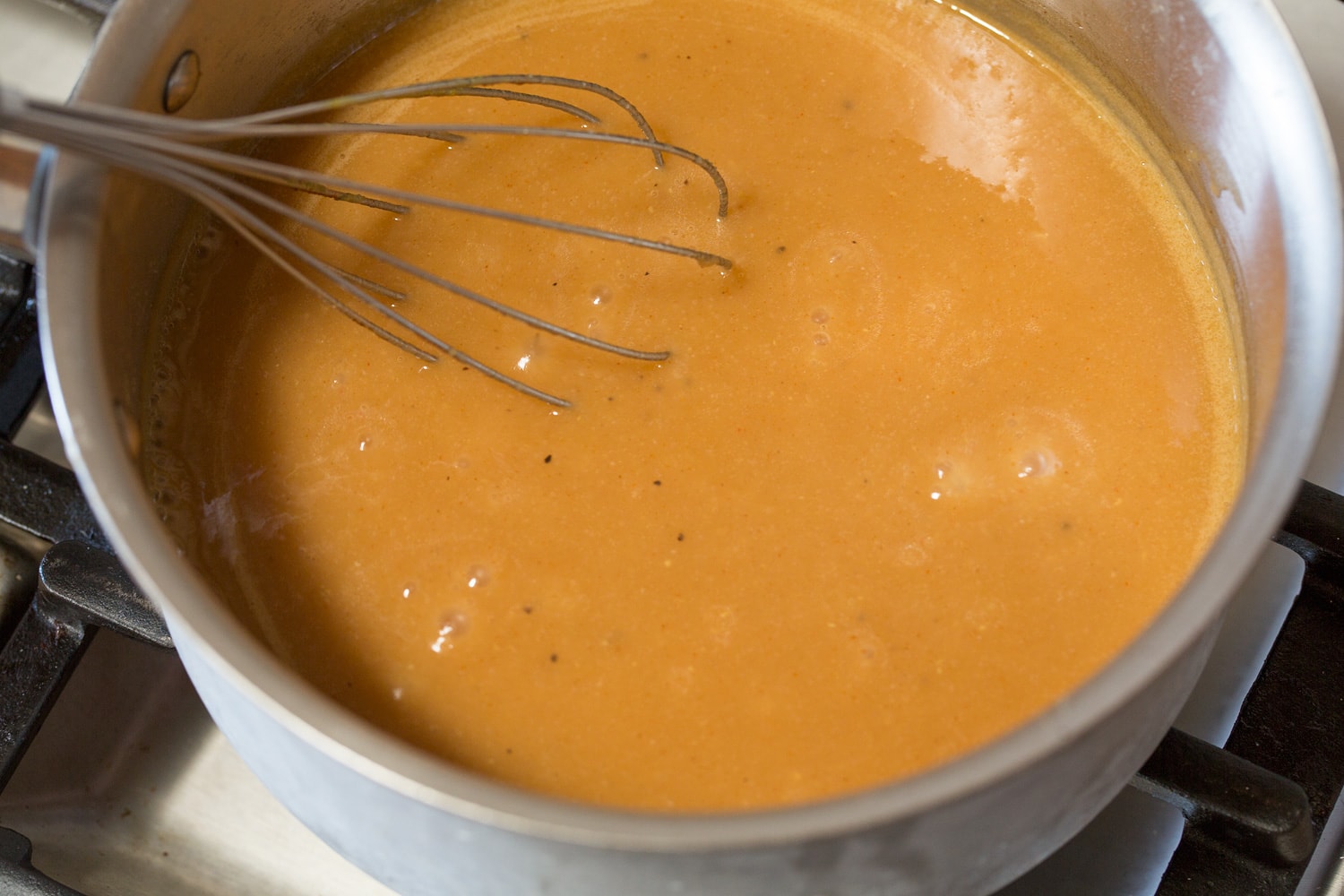 Chicken Gravy Completed chicken gravy in stainless saucepan.
