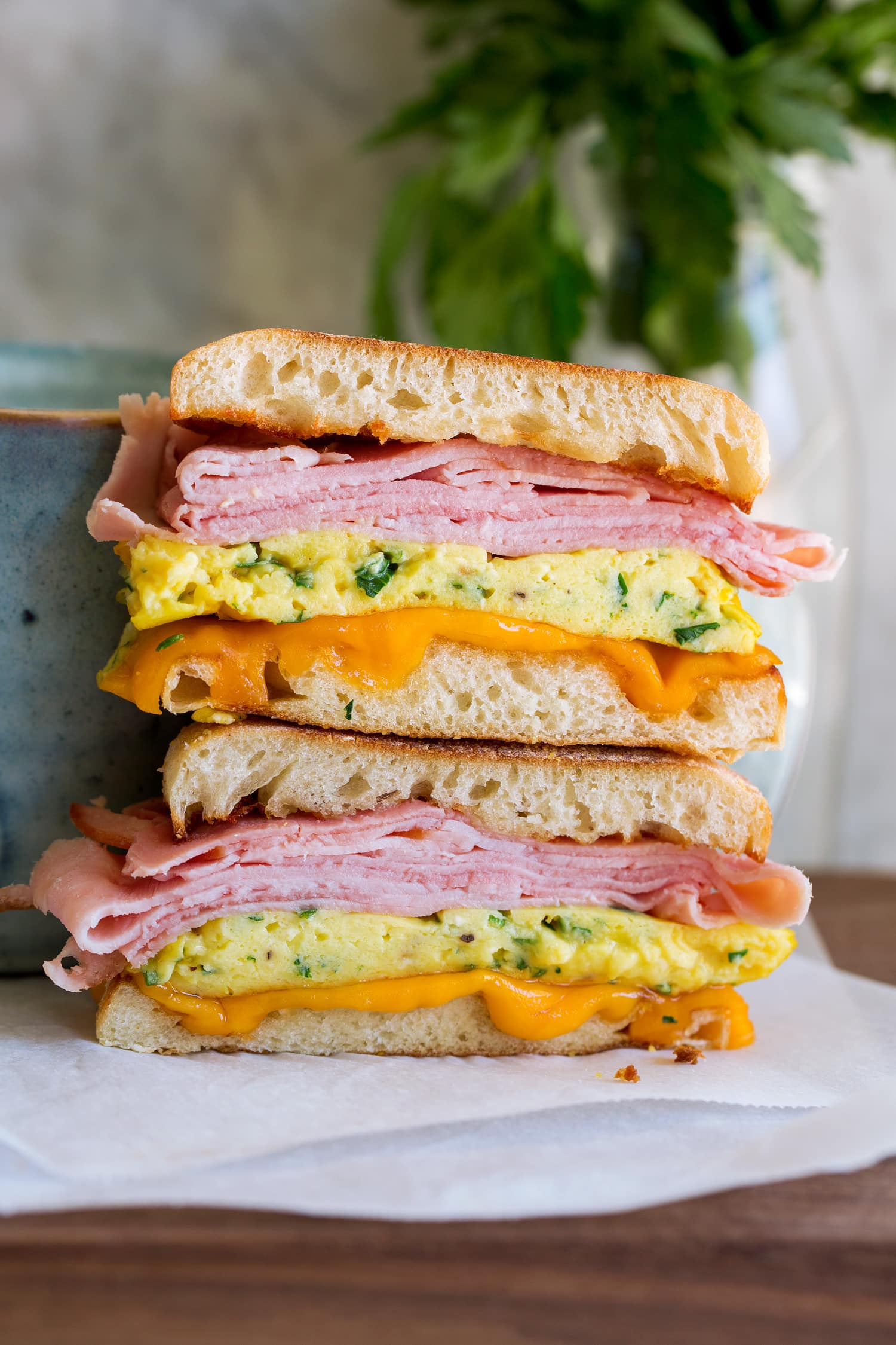 Breakfast Sandwiches Breakfast sandwiches sliced in half.