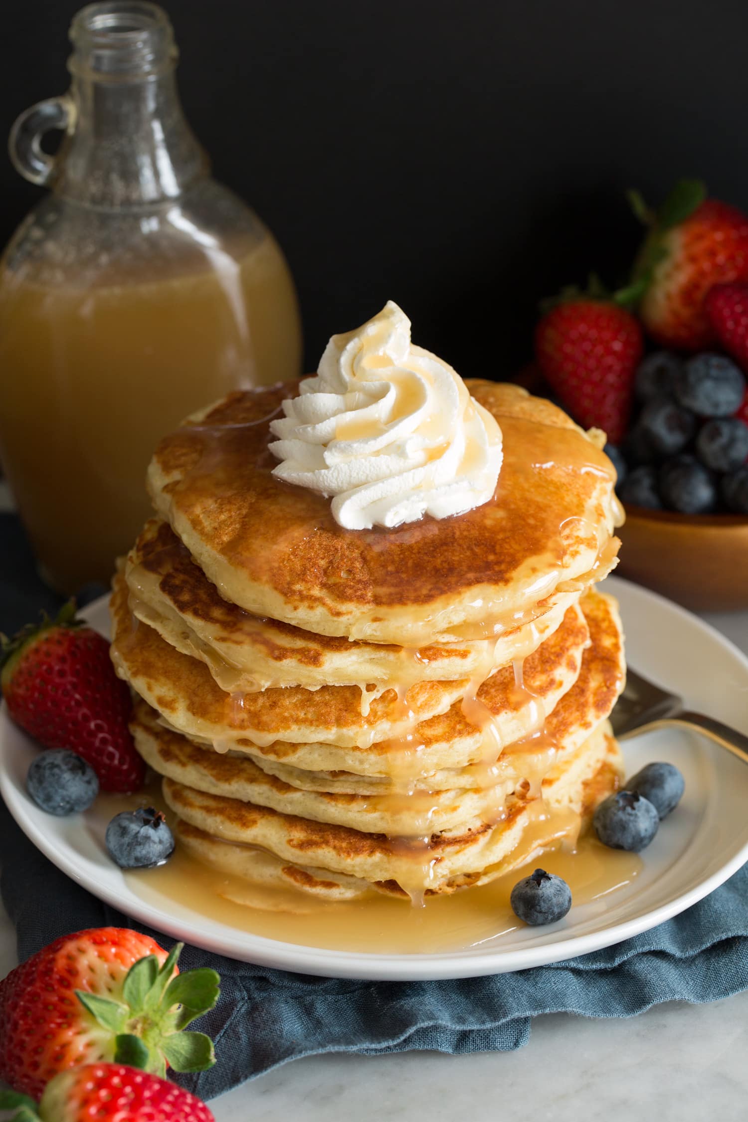Buttermilk Syrup Homemade vanilla buttermilk syrup over pancakes with fresh fruit.