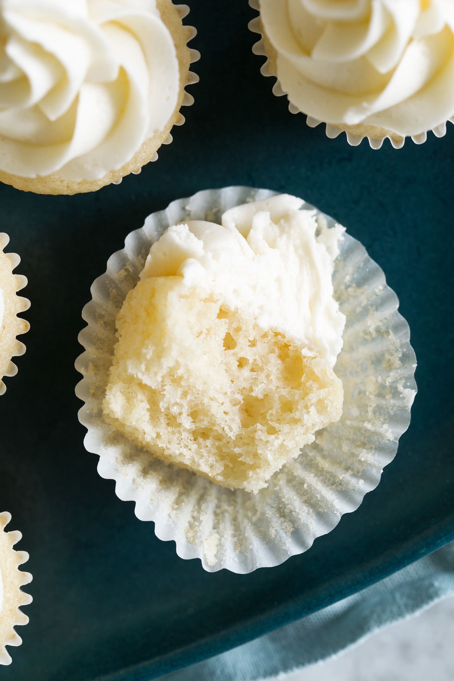 Mini Cupcakes Mini cupcake cut into shown close up to see fluffy texture of crumb.