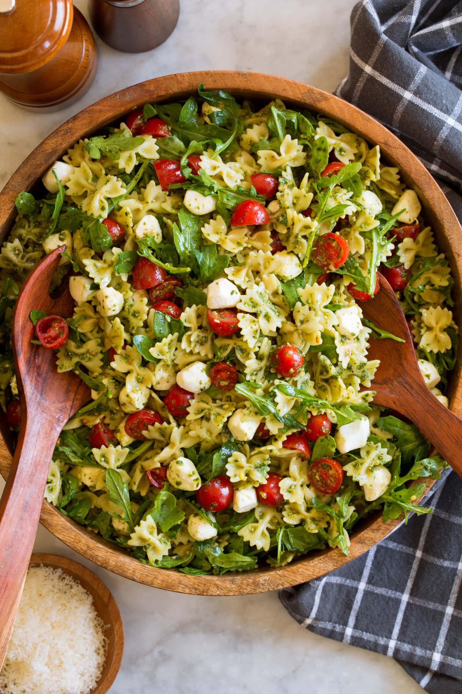 Pesto Pasta Salad Overhead photo of pesto pasta salad in a wood serving bowl.