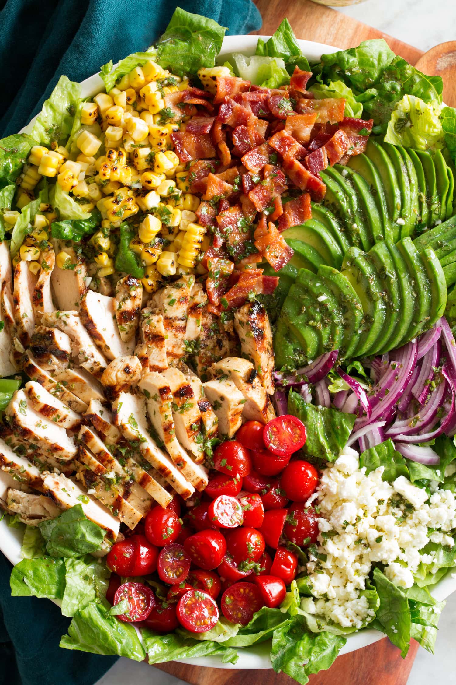 Grilled Chicken Salad Close up photo of grilled chicken salad showing various ingredient textures and colors.