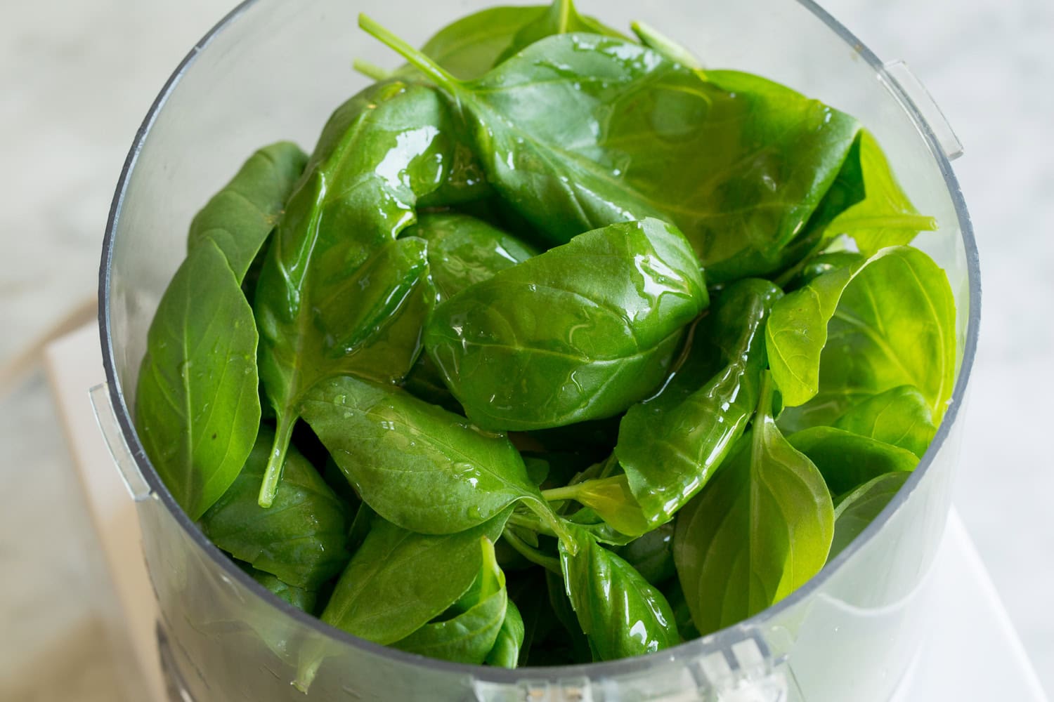 Creamy Pesto Pasta Fresh basil, oil and water in a food processor.