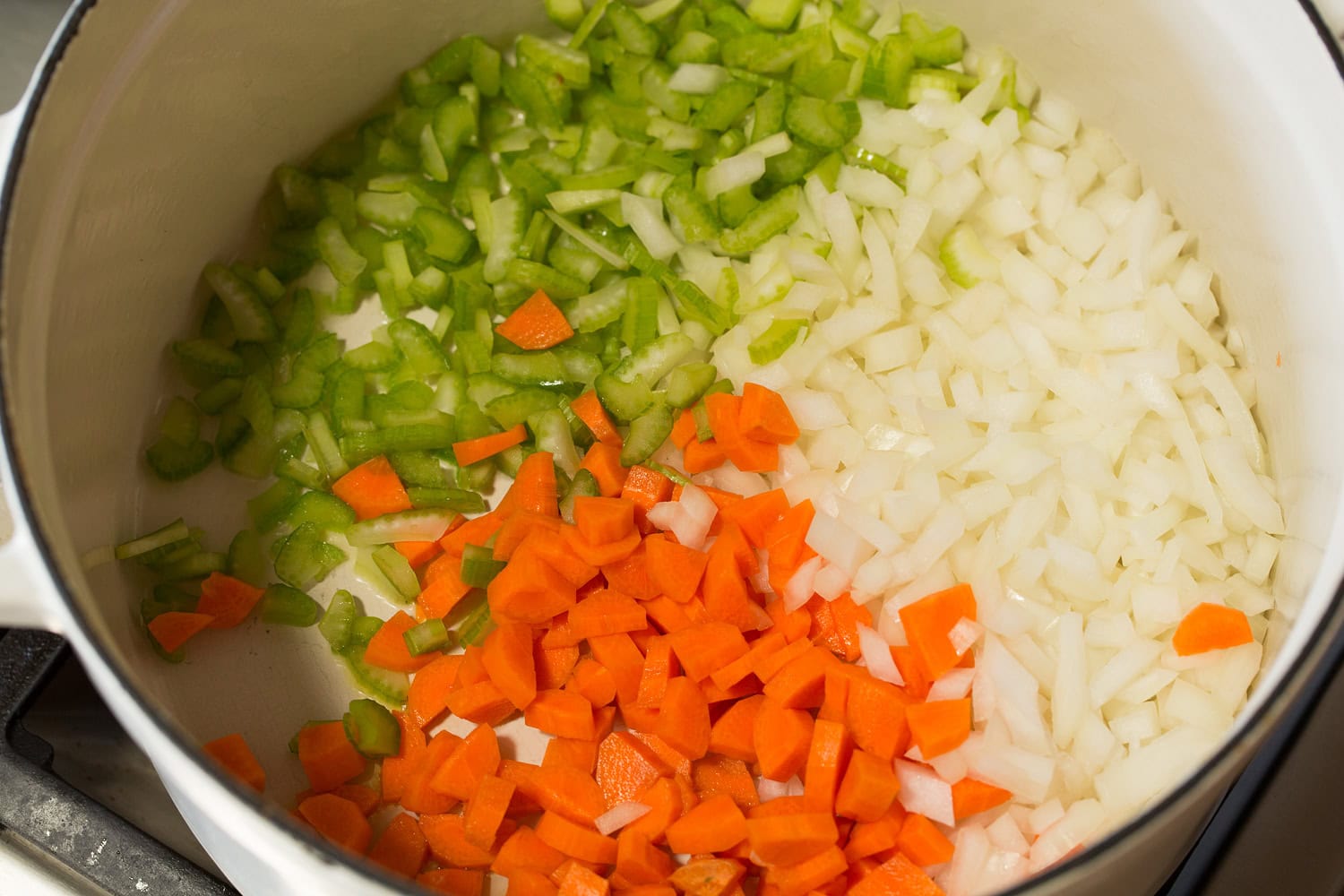 Meatball Soup Raw vegetable mixture in pot.