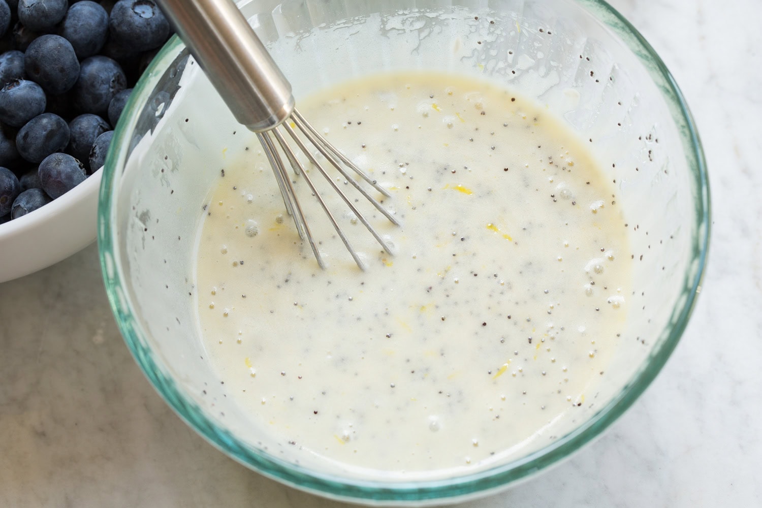 Blueberry Salad Creamy lemon poppy seed dressing shown after mixing.