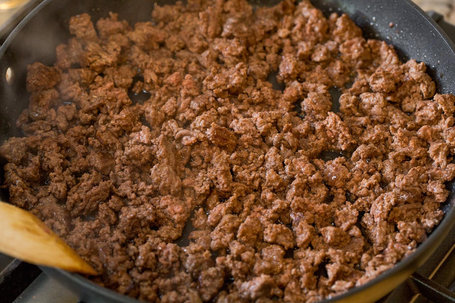 Burger Bowls Crumbled cooked beef in skillet.