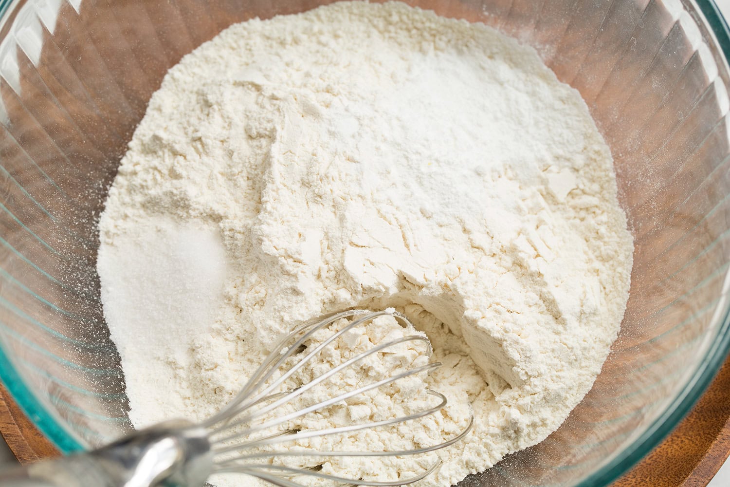 Lemon Pound Cake Whisking flour, baking powder, baking soda and salt in a glass bowl.