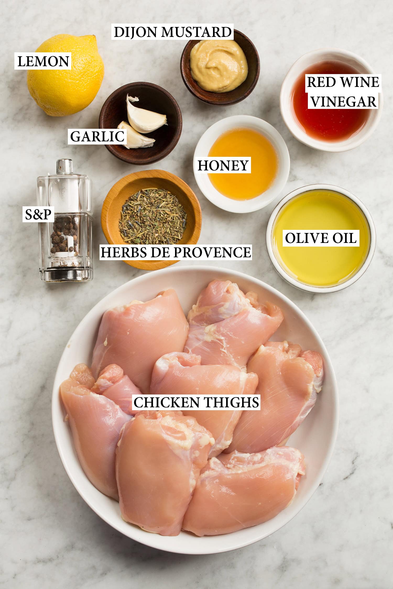 Ingredients used to make grilled chicken thighs and marinade shown.